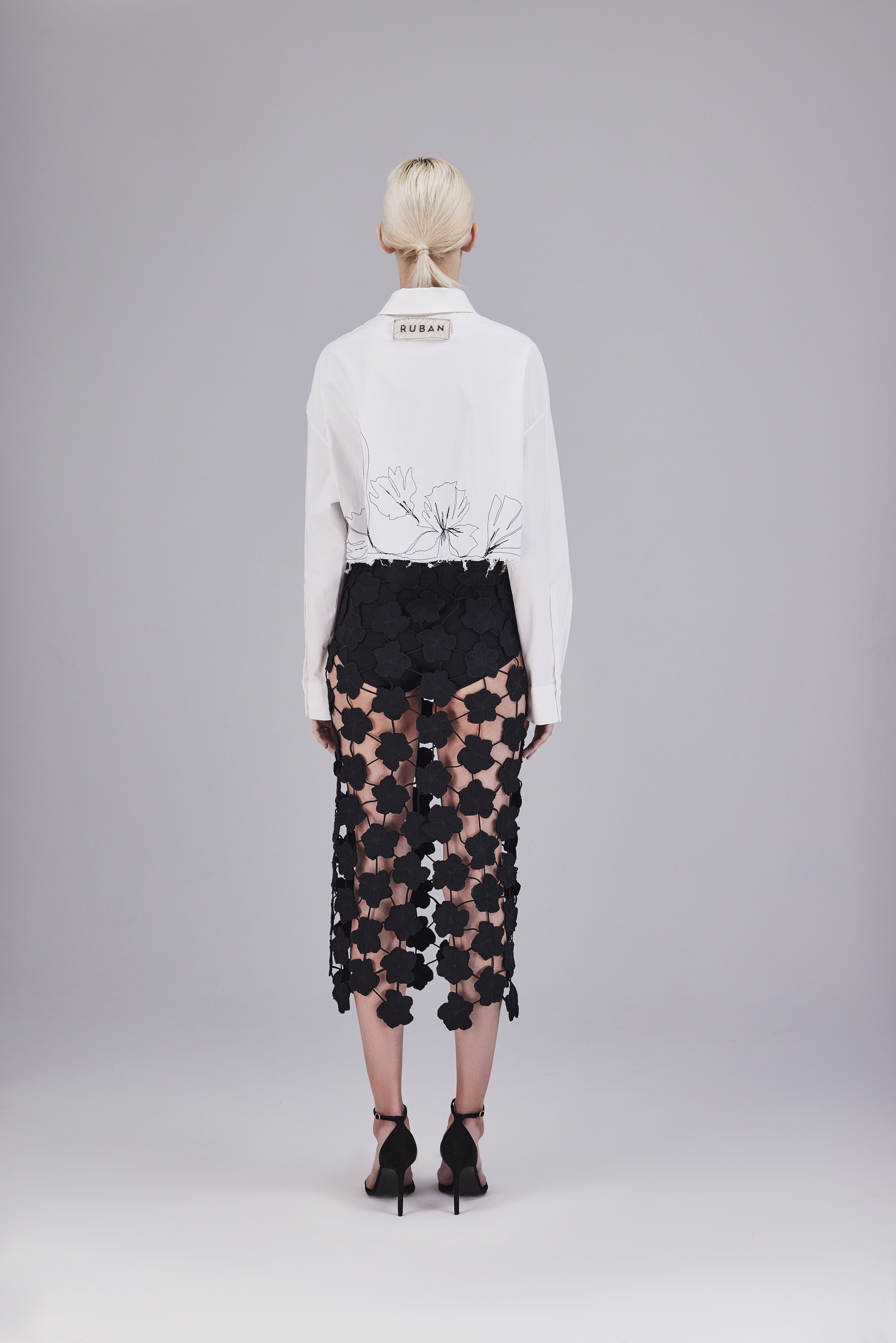 Braided skirt with embroidered flowers
