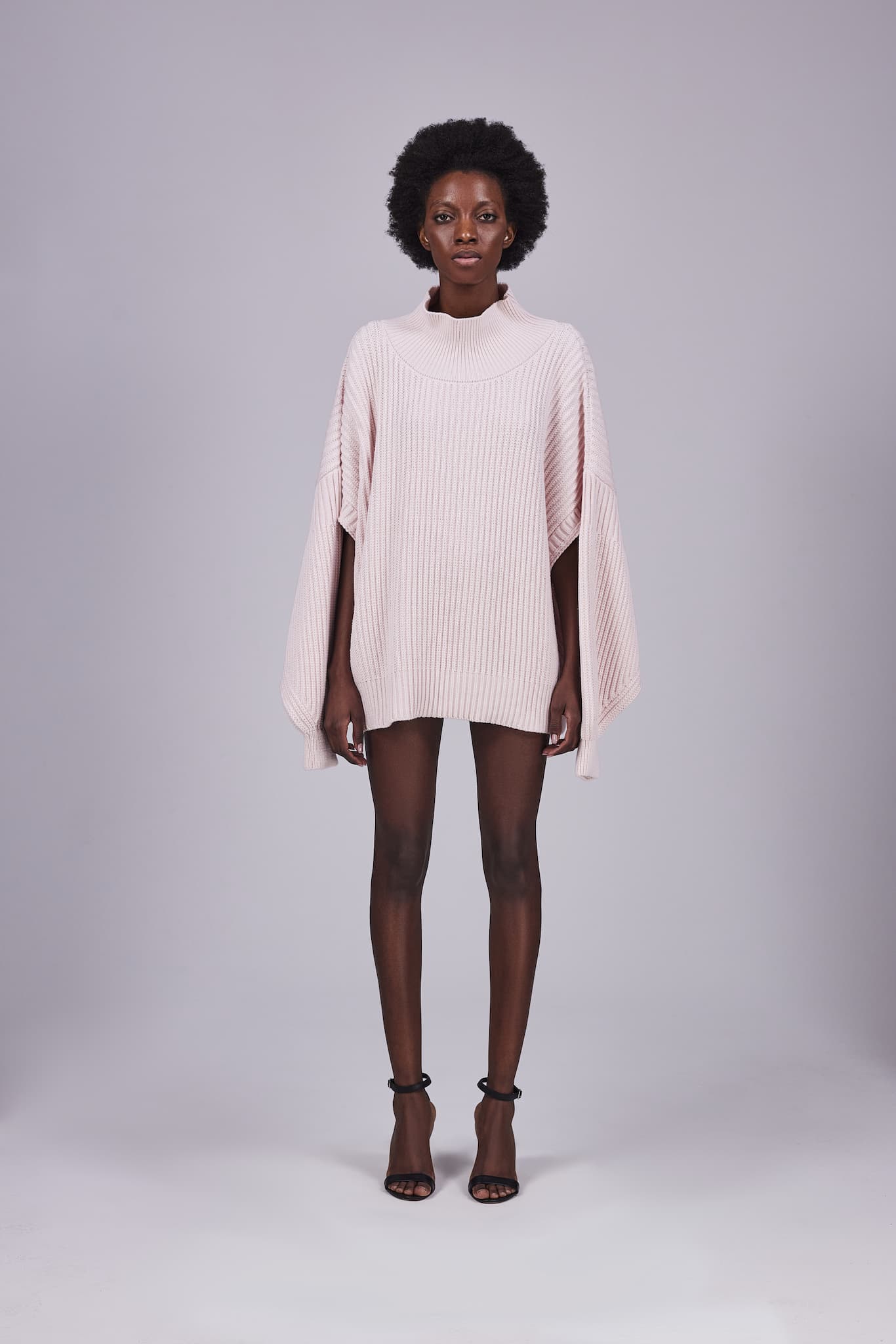 Jumper with slits on the sleeves