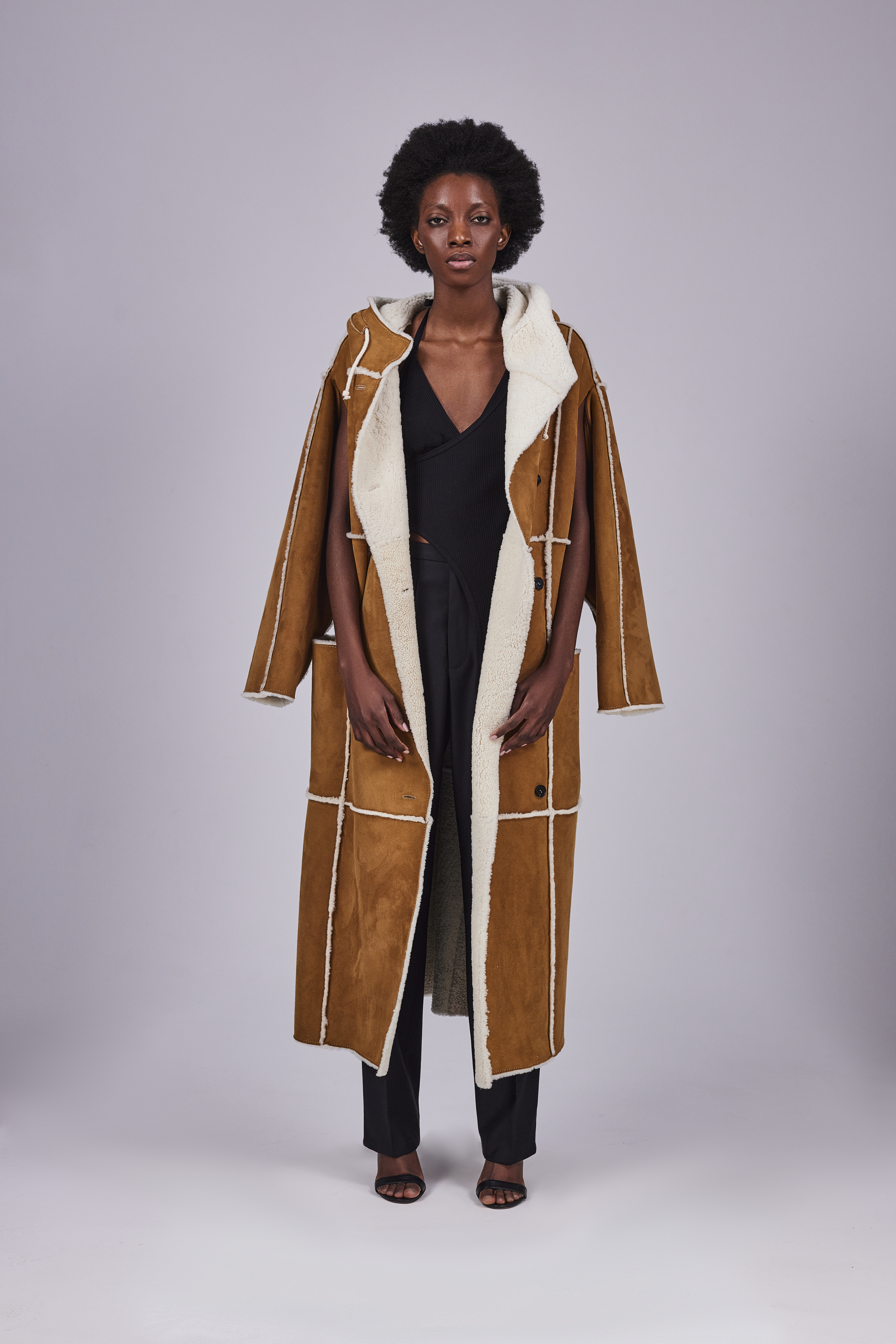  Sheepskin coat with a hood and zippers in the sleeves